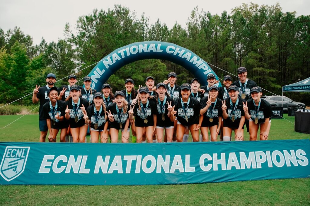 slammers fc hb koge u14 (2010) group picture with national championship banners, trophy, and medals